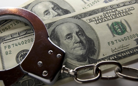 Handcuffs on top of money